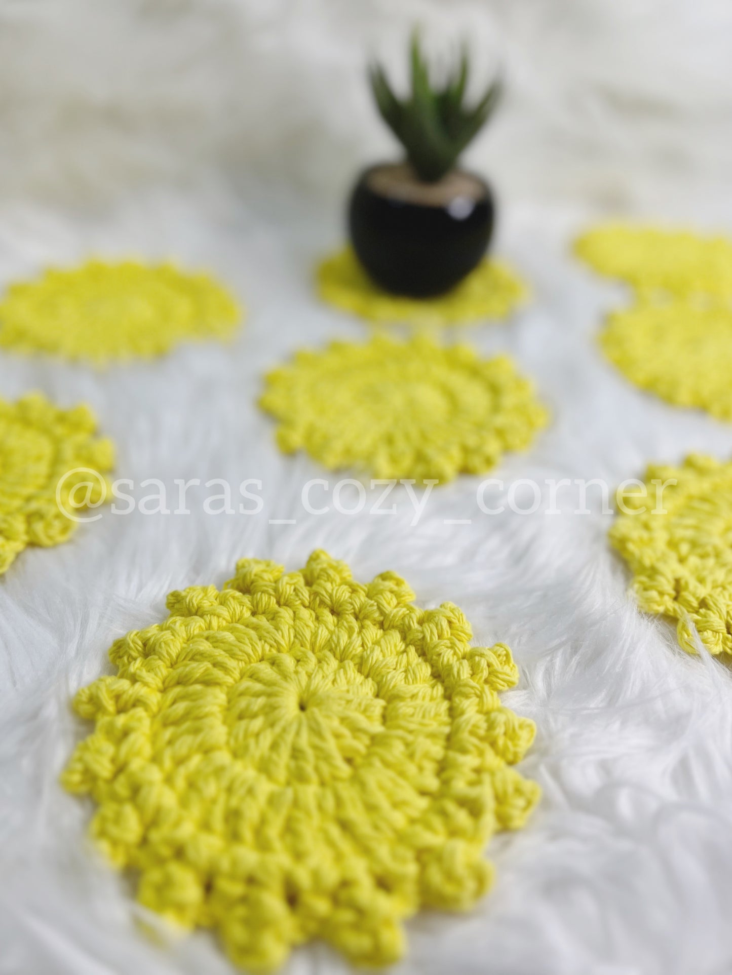 Bright yellow crochet cotton coaster