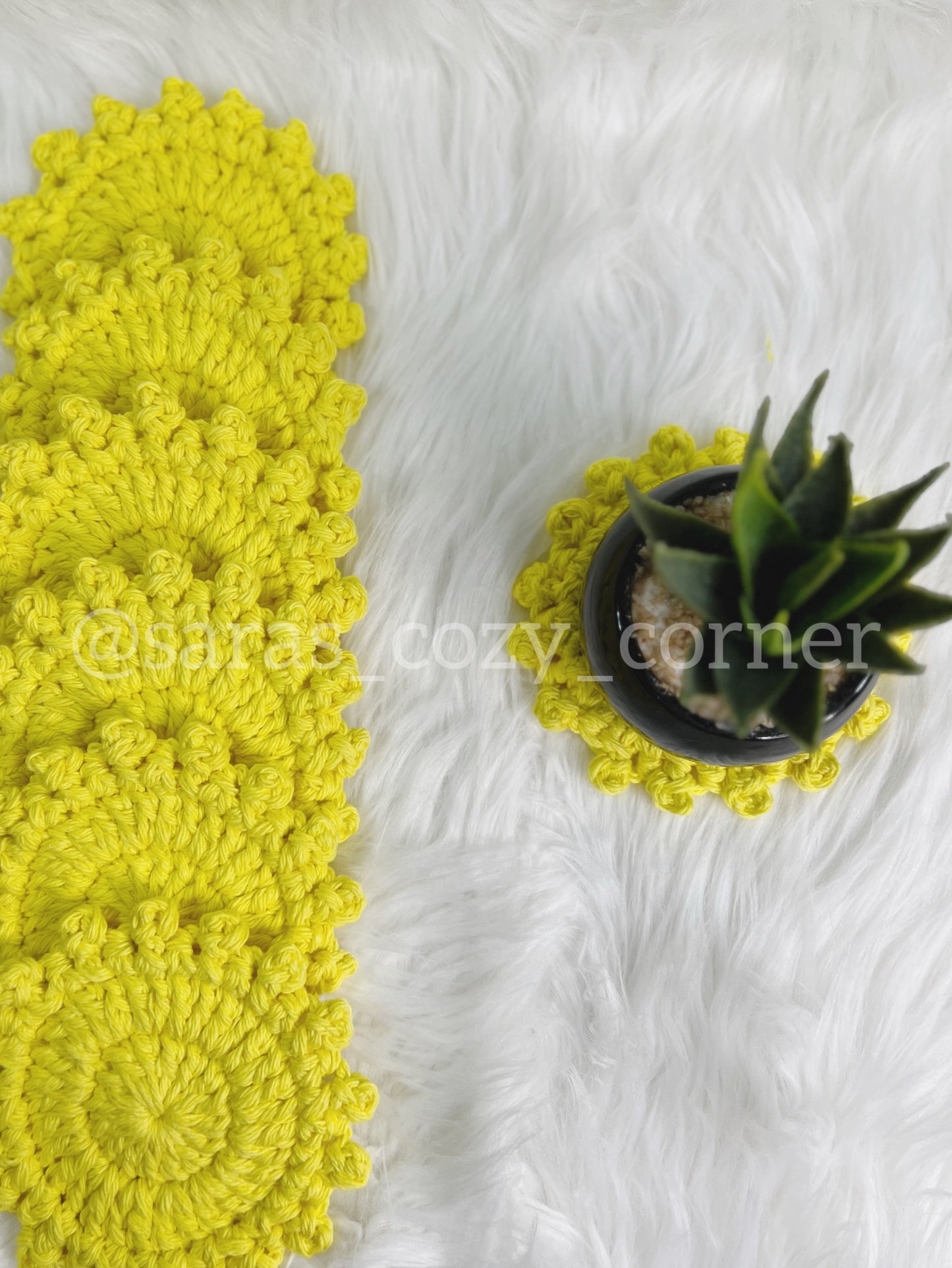 Bright yellow crochet cotton coaster